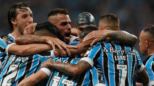 TAÇA LIBERTADORES DA AMÉRICA. 2018. GRUPO 1. GRÊMIO-RS. BRASIL. CERRO PORTEÑO. PARAGUAI. MONAGAS. VENEZUELA. DEFENSOR SPORTING. URUGUAI. GRUPO 6. SANTOS-SP. BRASIL. ESTUDIANTES. ARGENTINA. REAL GARCILASO. PERU. NACIONAL. URUGUAI.